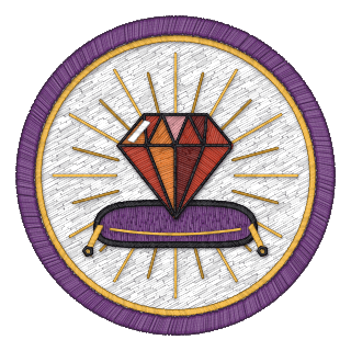 Ruby badge: a cut ruby on a velvet cushion